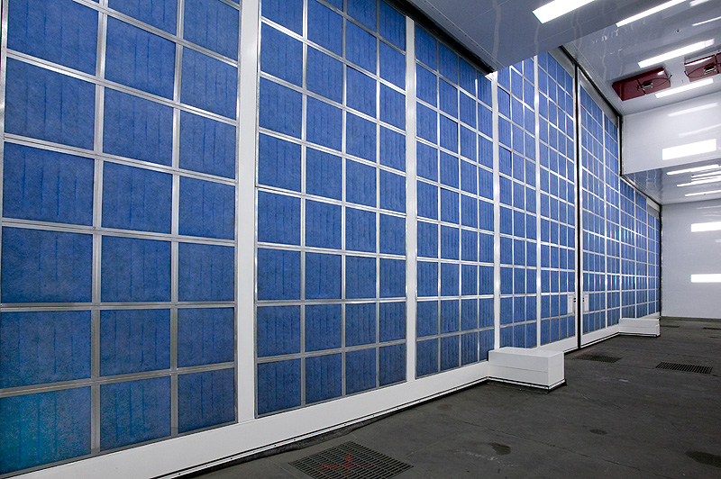Click to enlarge Detail of the back side of the front door of the aerospace paint booth with intake air filters in blue