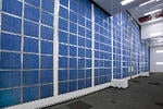 Detail of the back side of the front door of the aerospace paint booth with intake air filters in blue
