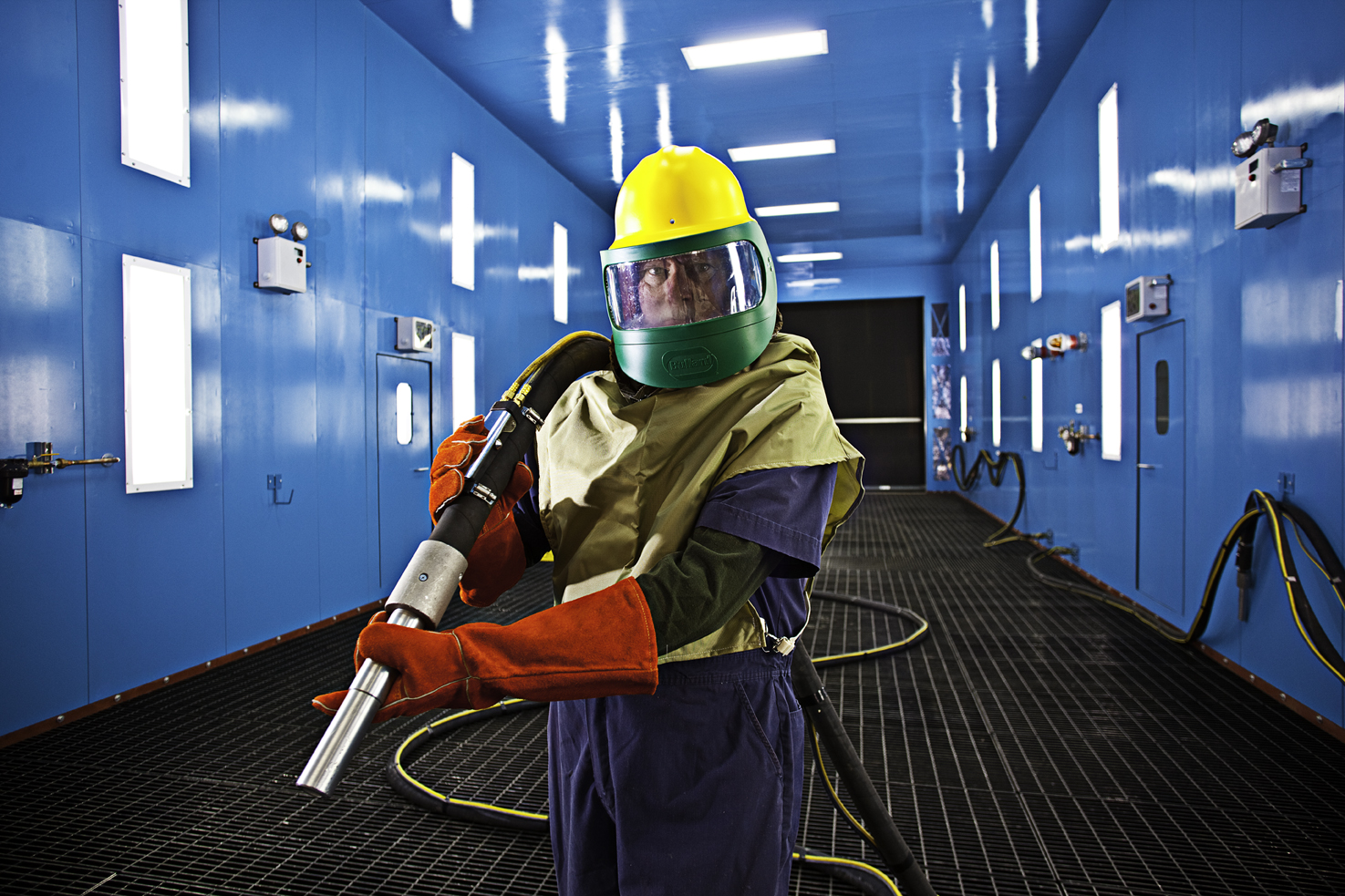 Blast Room Operator in Protective Gear
