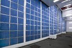 Detail of the back side of the front door of the aerospace paint booth with intake air filters in blue